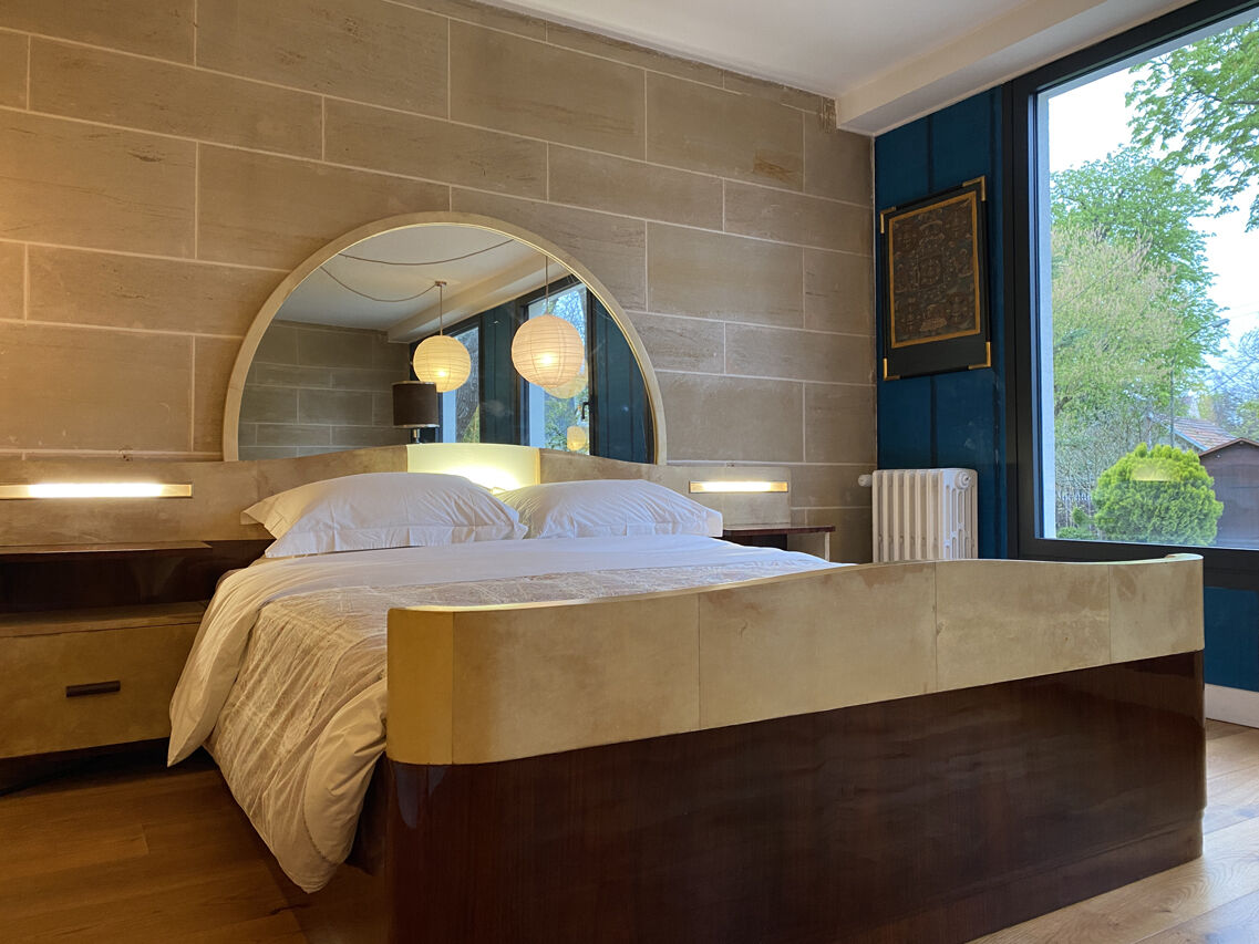 Bed with integrated bedside in rosewood and parchment, art deco period, twentieth century