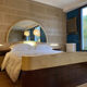 Bed with integrated bedside in rosewood and parchment, art deco period, twentieth century