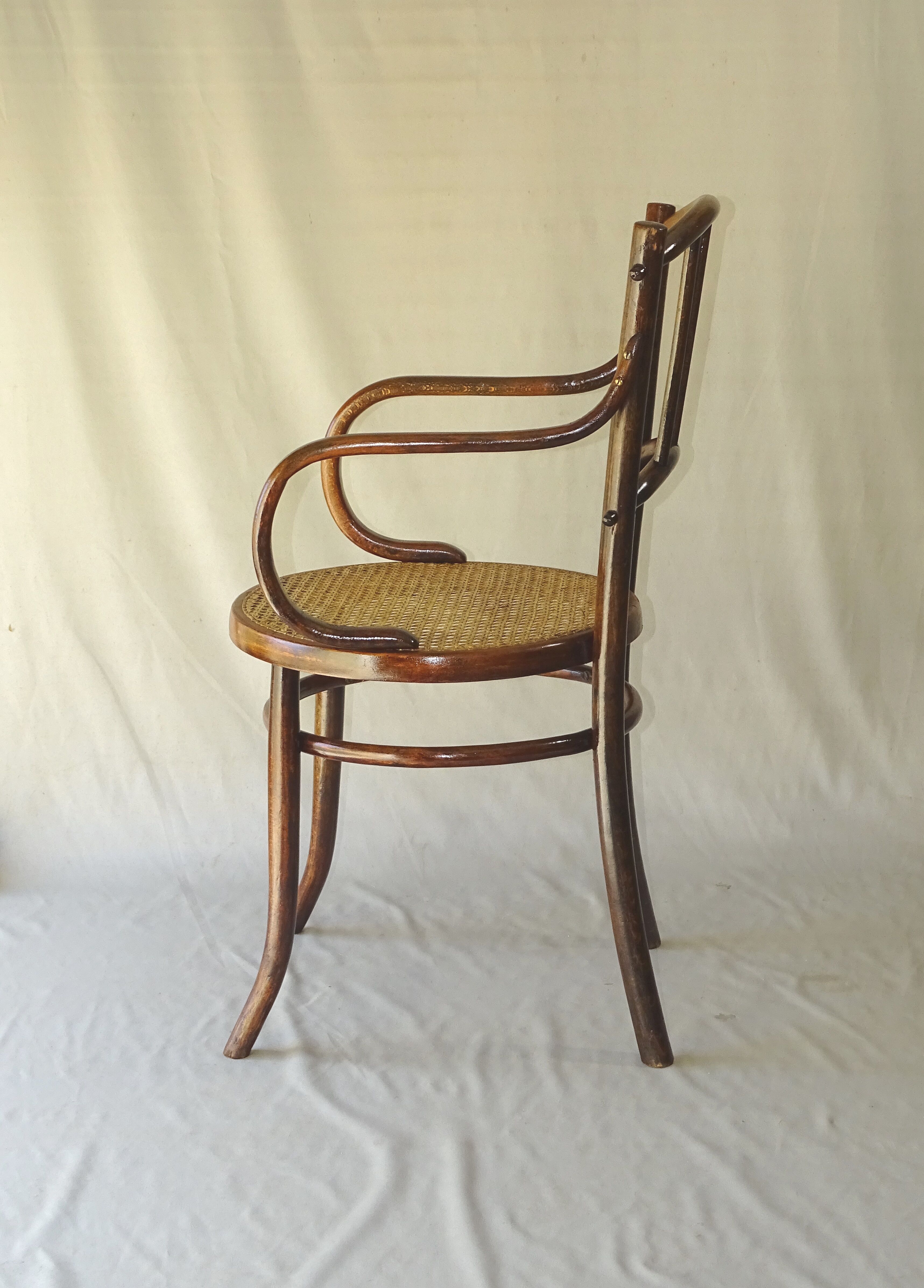 Small canned armchair; in curved wood, bistro, 1890