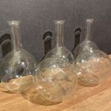 Suite of 5 bakings, bottles with long glass neck