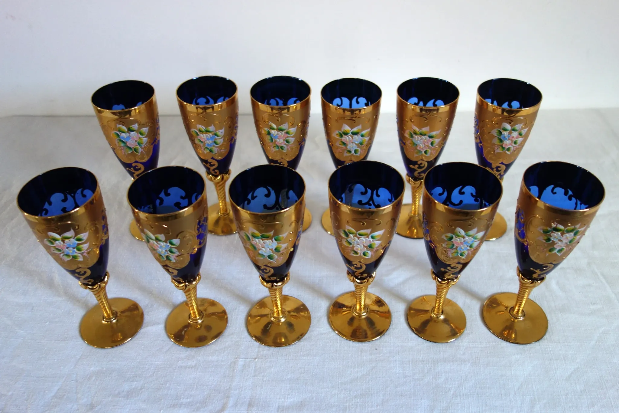 12 cobalt blue and gold Murano glass flutes, mid-20th century.
