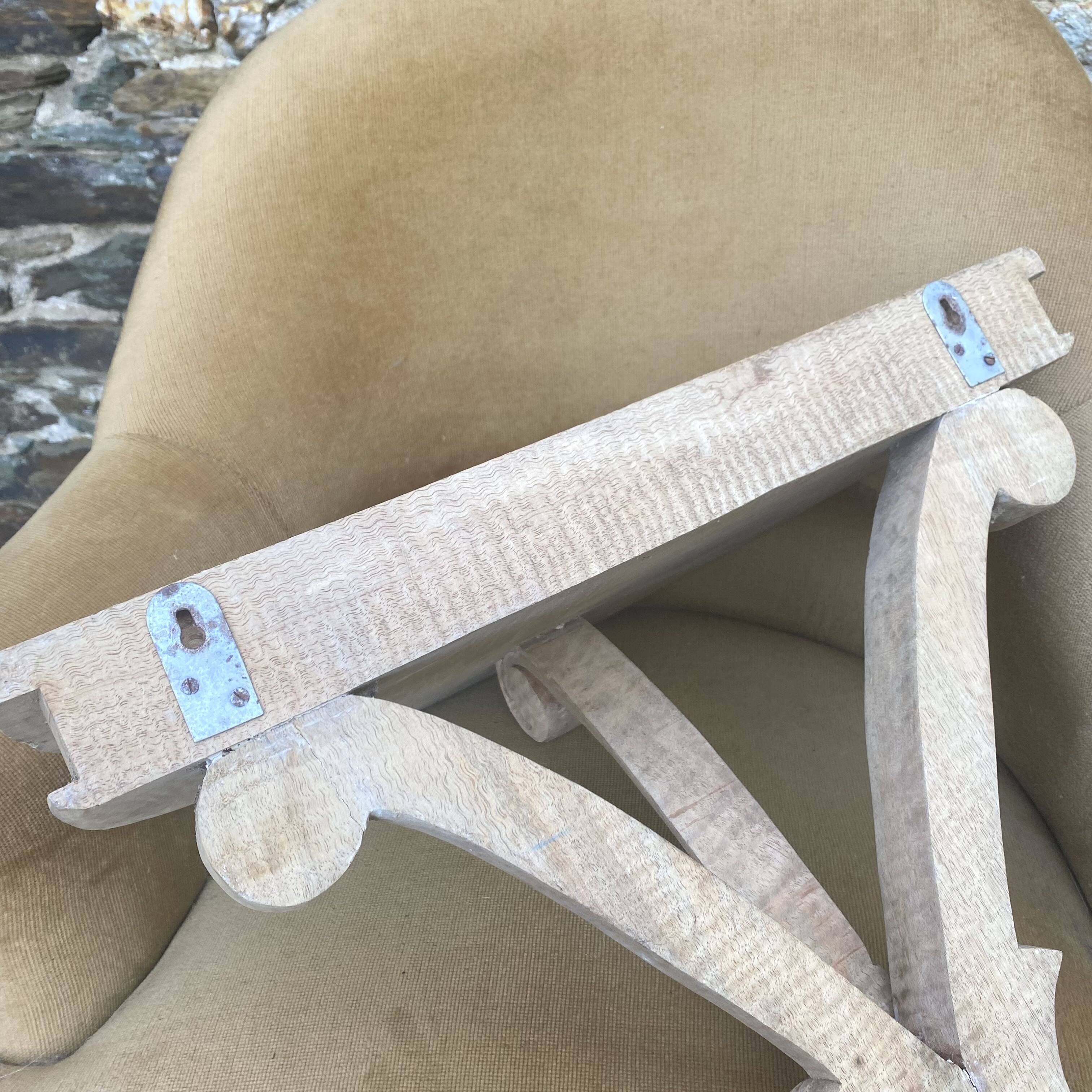 carved wooden wall shelf or wall console