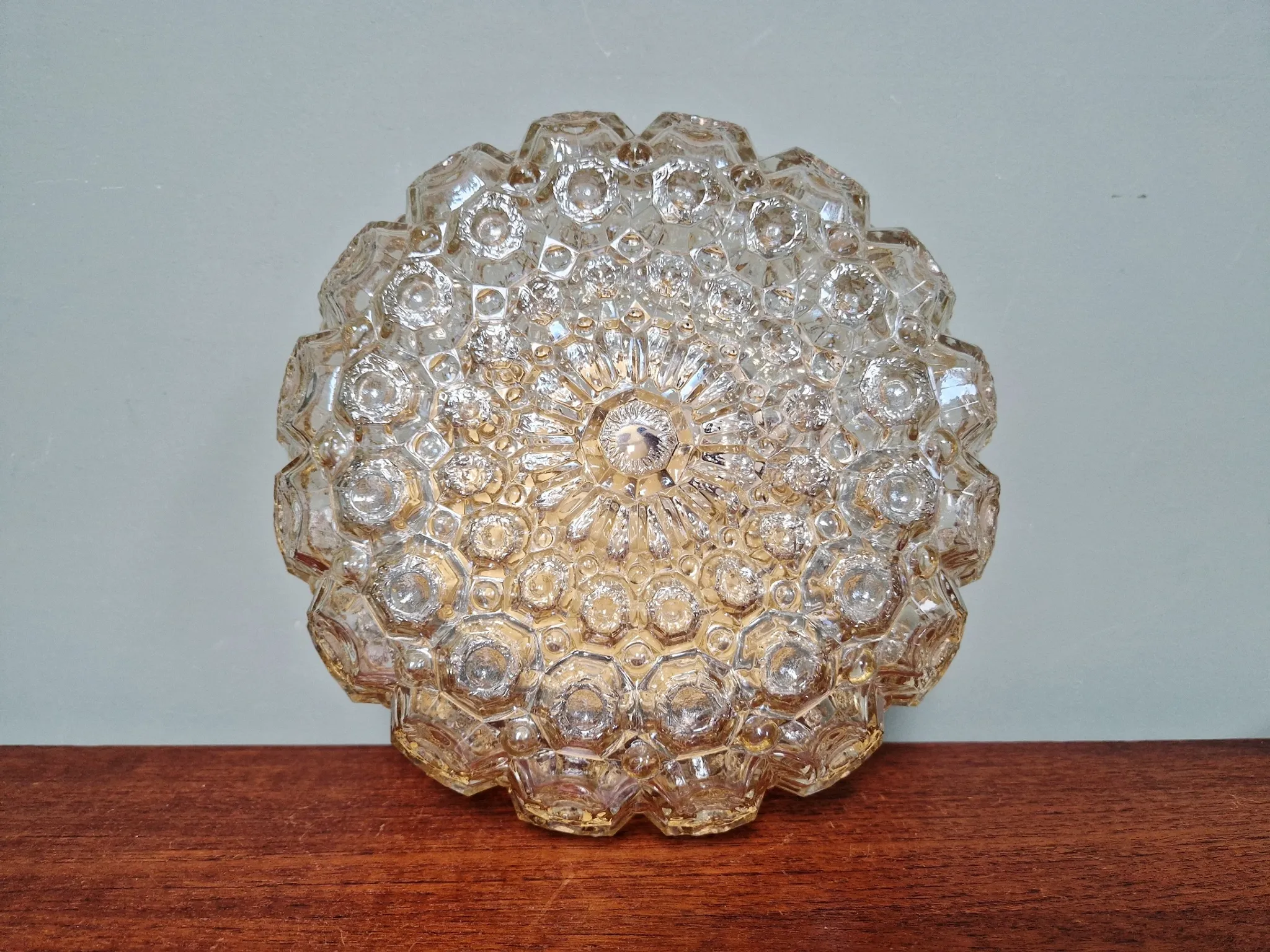 Amber glass honeycomb ceiling light, design by Helena Tynell, 1970.