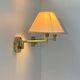 Pair of vintage adjustable wall lights, brass and beige fabric, France, 1970