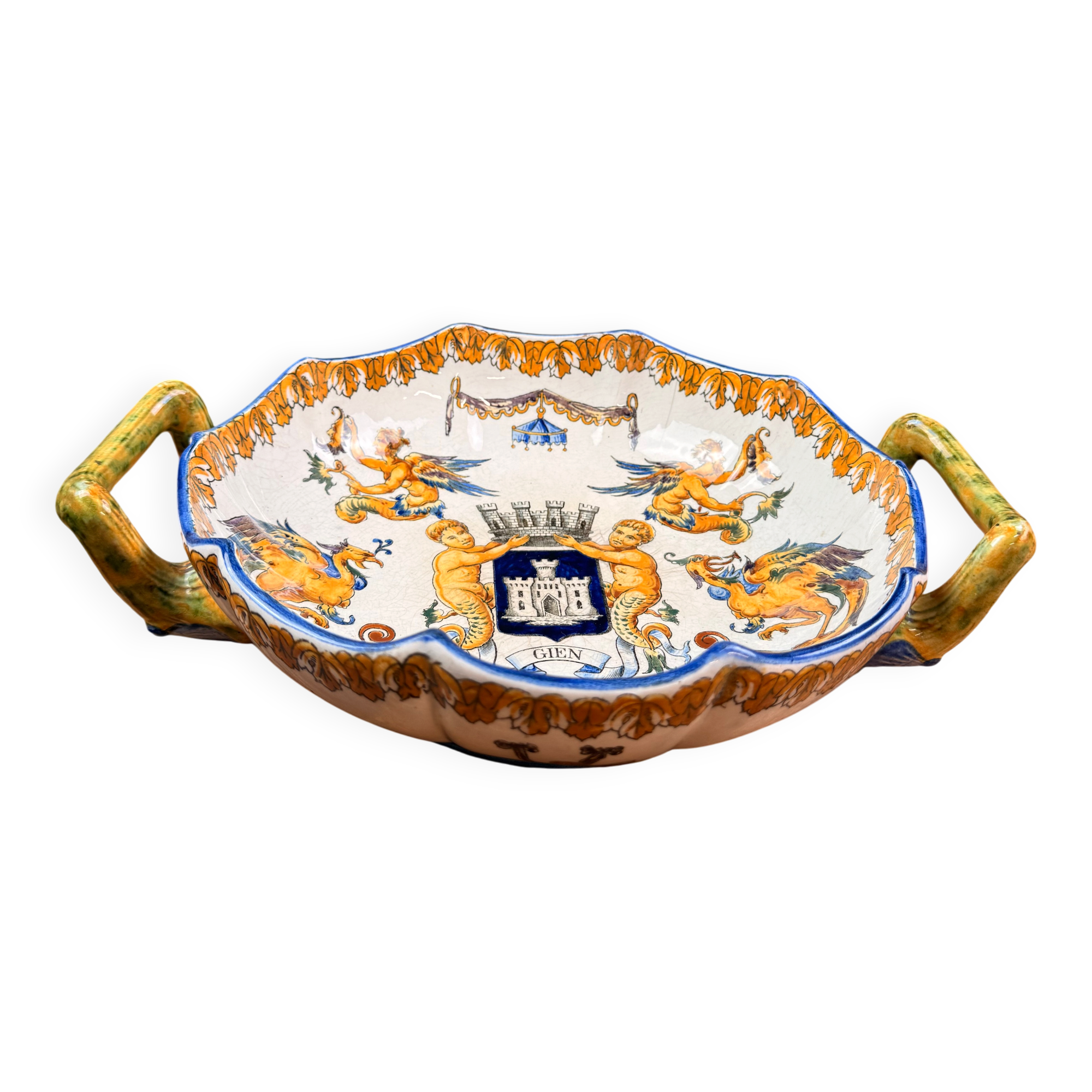 Handled coupe in Gien earthenware with heraldic and fantastic decoration.