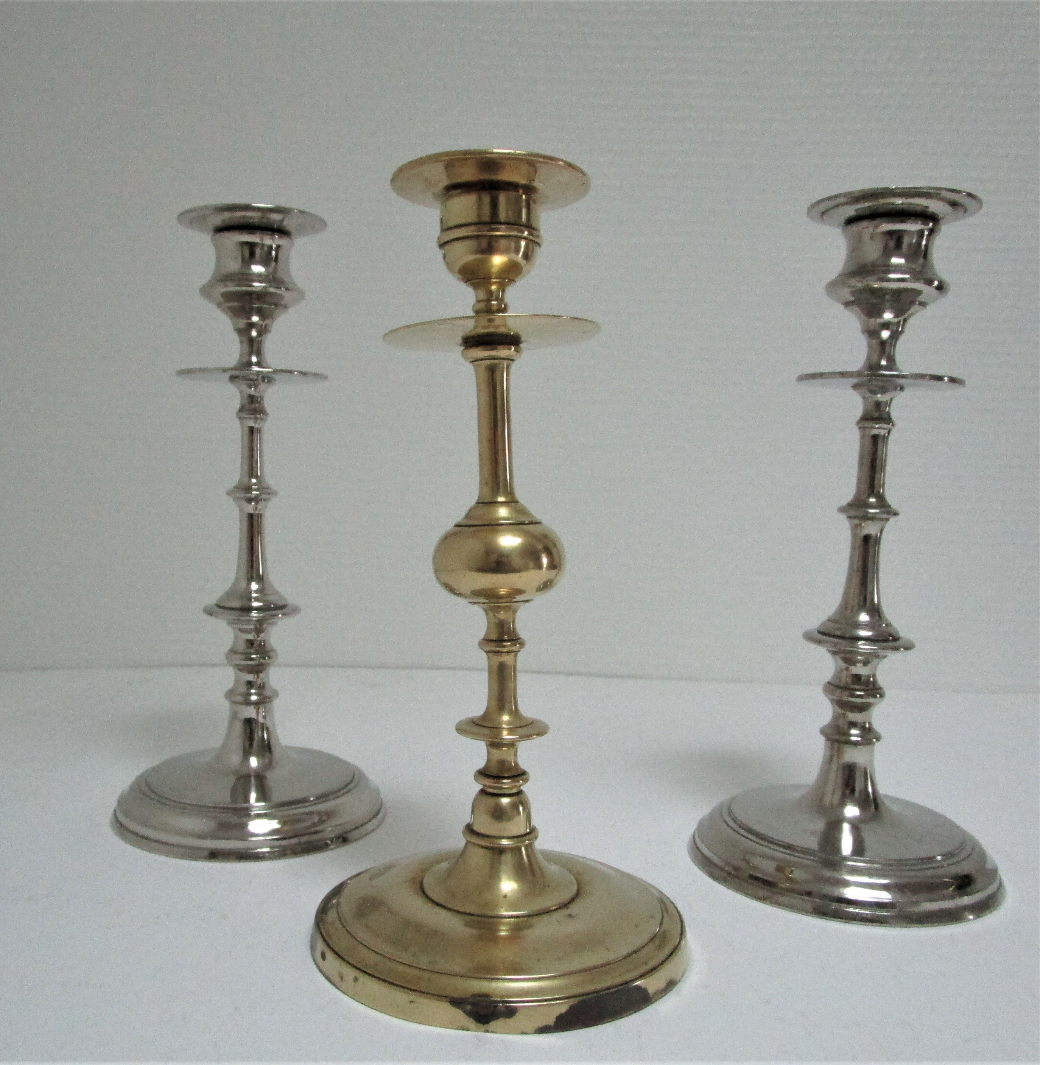 three brass and chrome candle holders early twentieth century