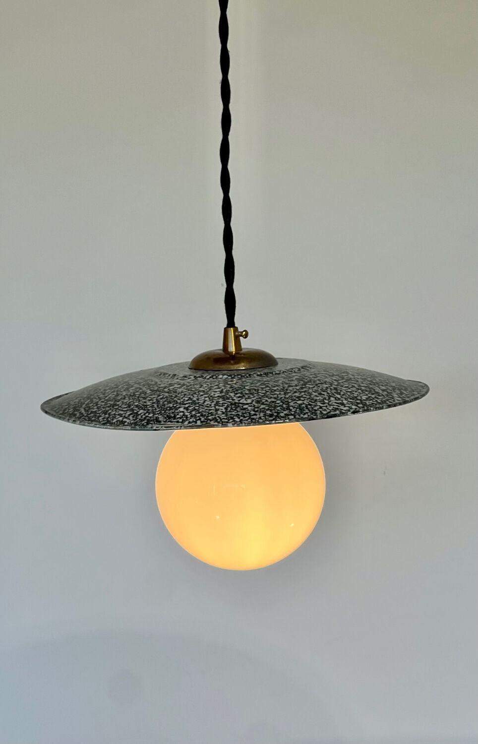 Industrial pendant light made of speckled enameled sheet metal and opaline