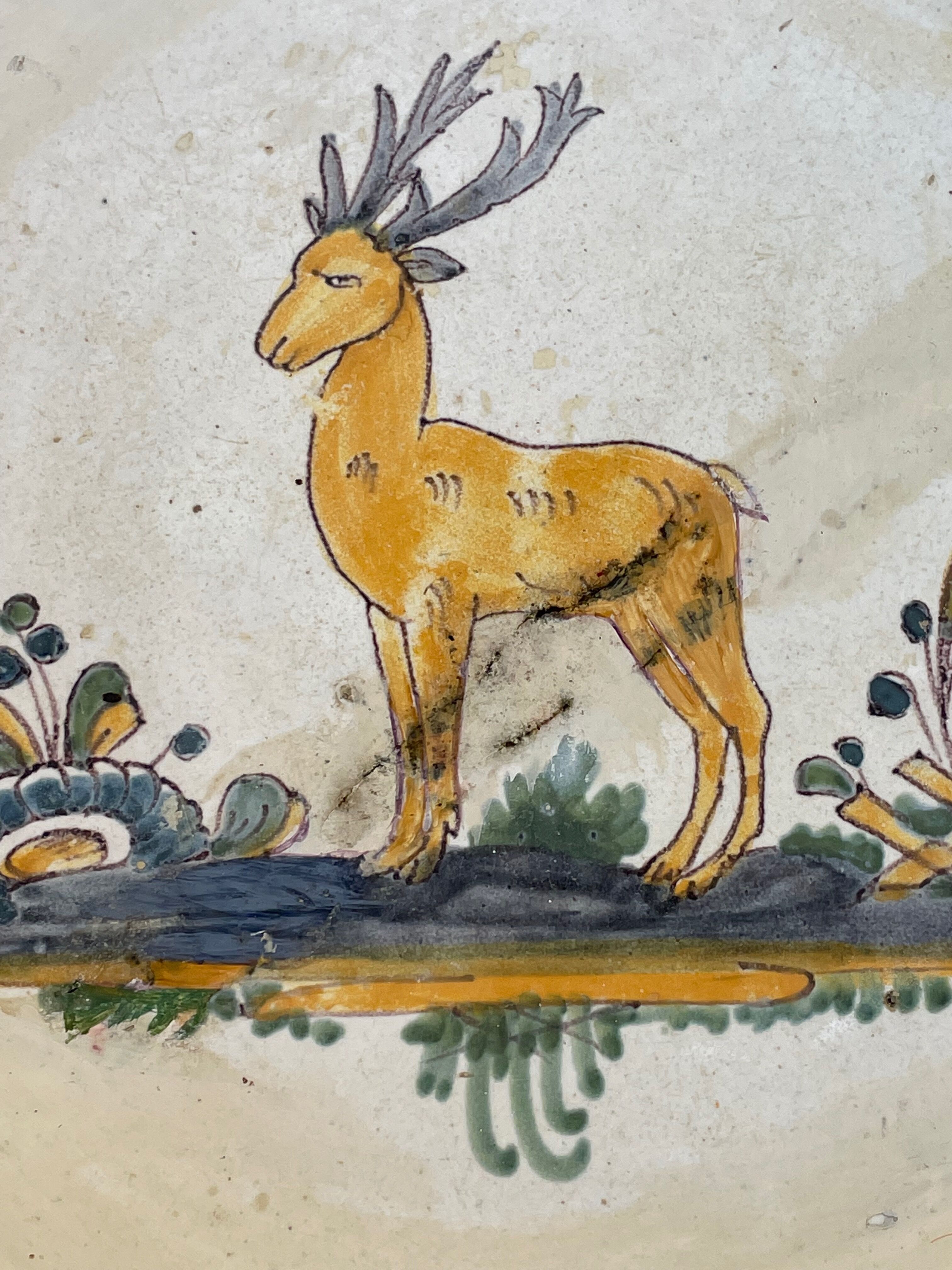 Antique dish with deer pattern