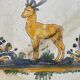 Antique dish with deer pattern