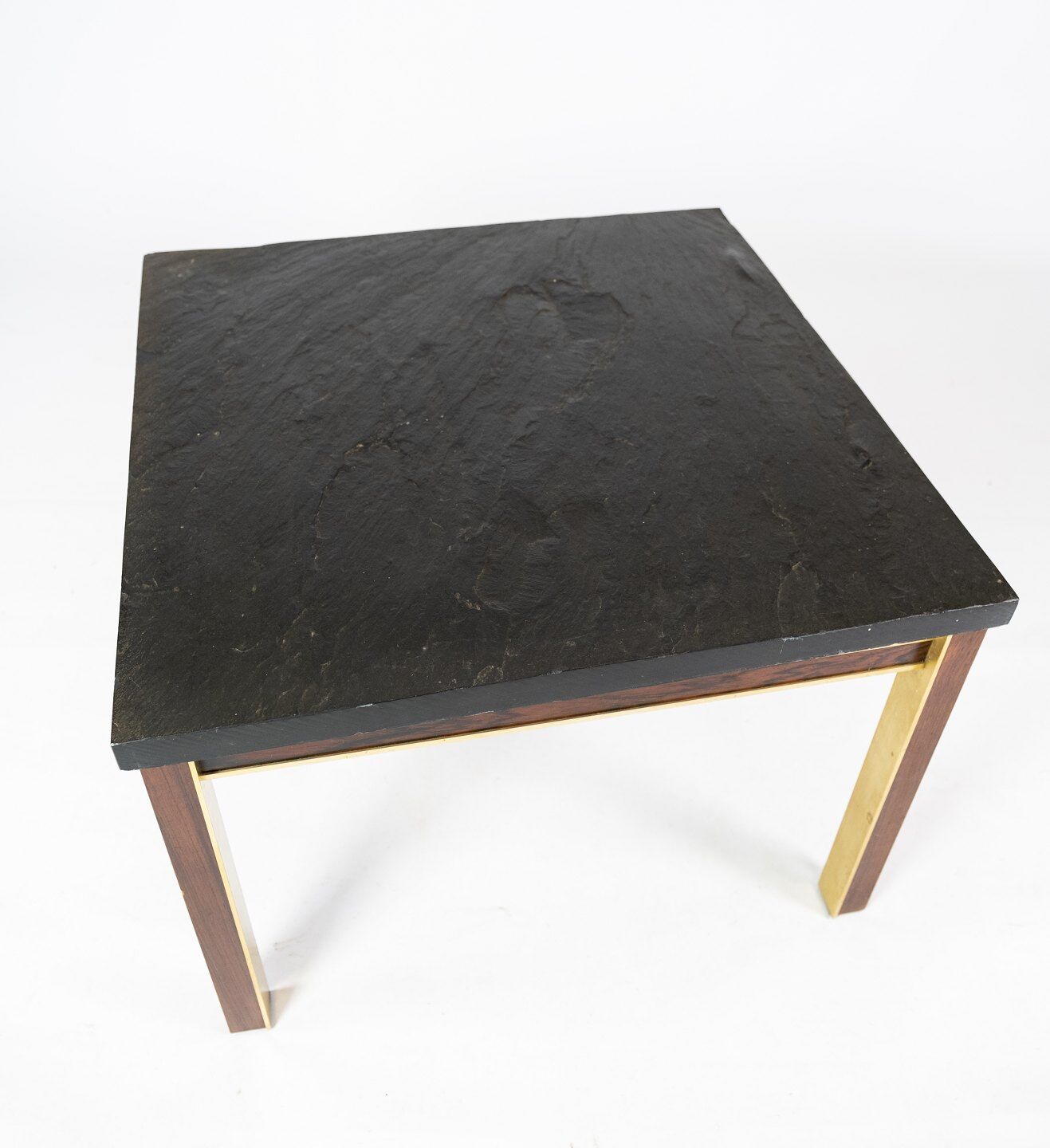 Coffee table with slate plate, frame of gilded metal and rosewood by Bendixen Design from the 1970s.