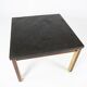 Coffee table with slate plate, frame of gilded metal and rosewood by Bendixen Design from the 1970s.