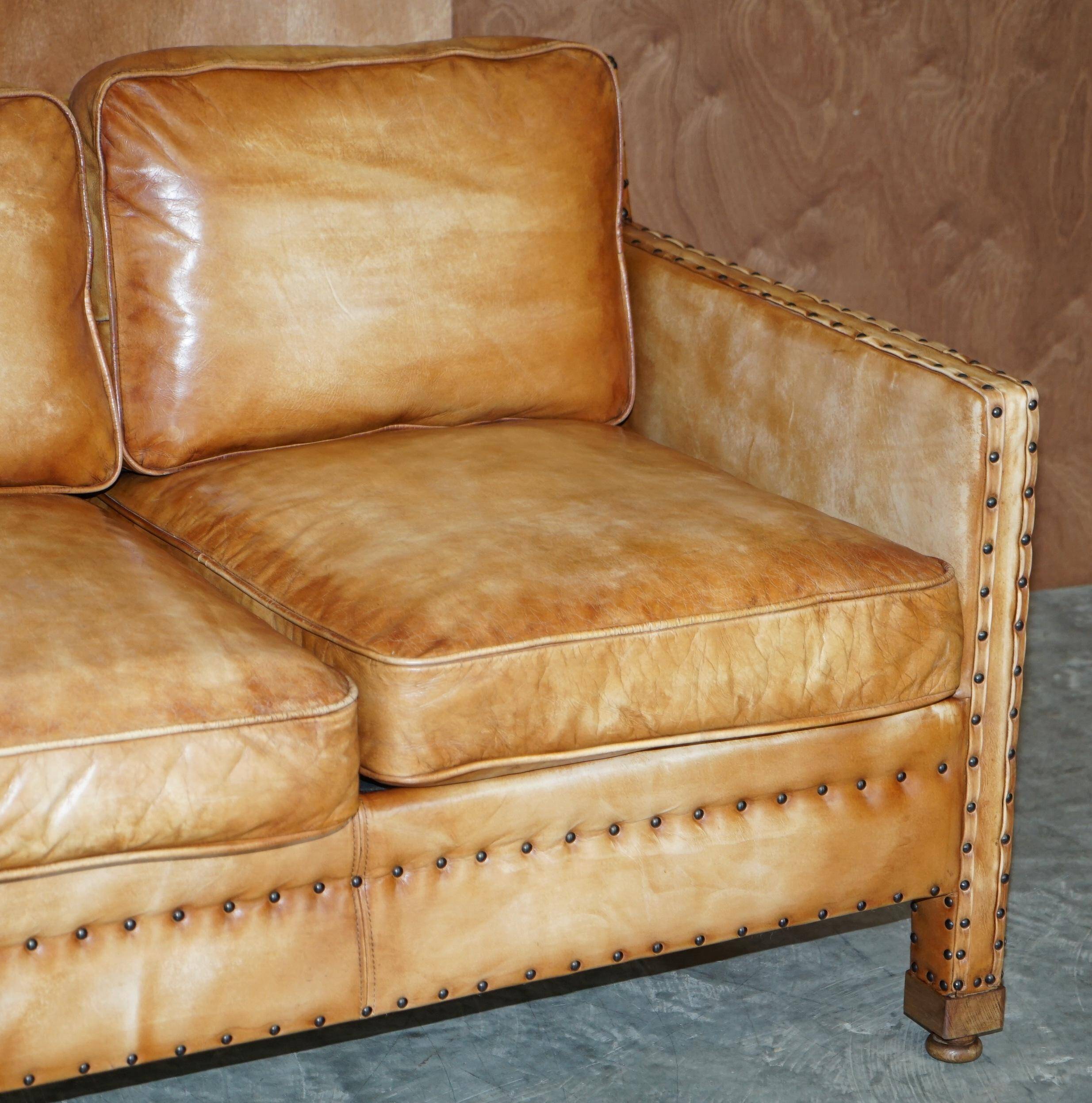 Two-seater leather canapé, hand-tanned, Edwardian style with studs.