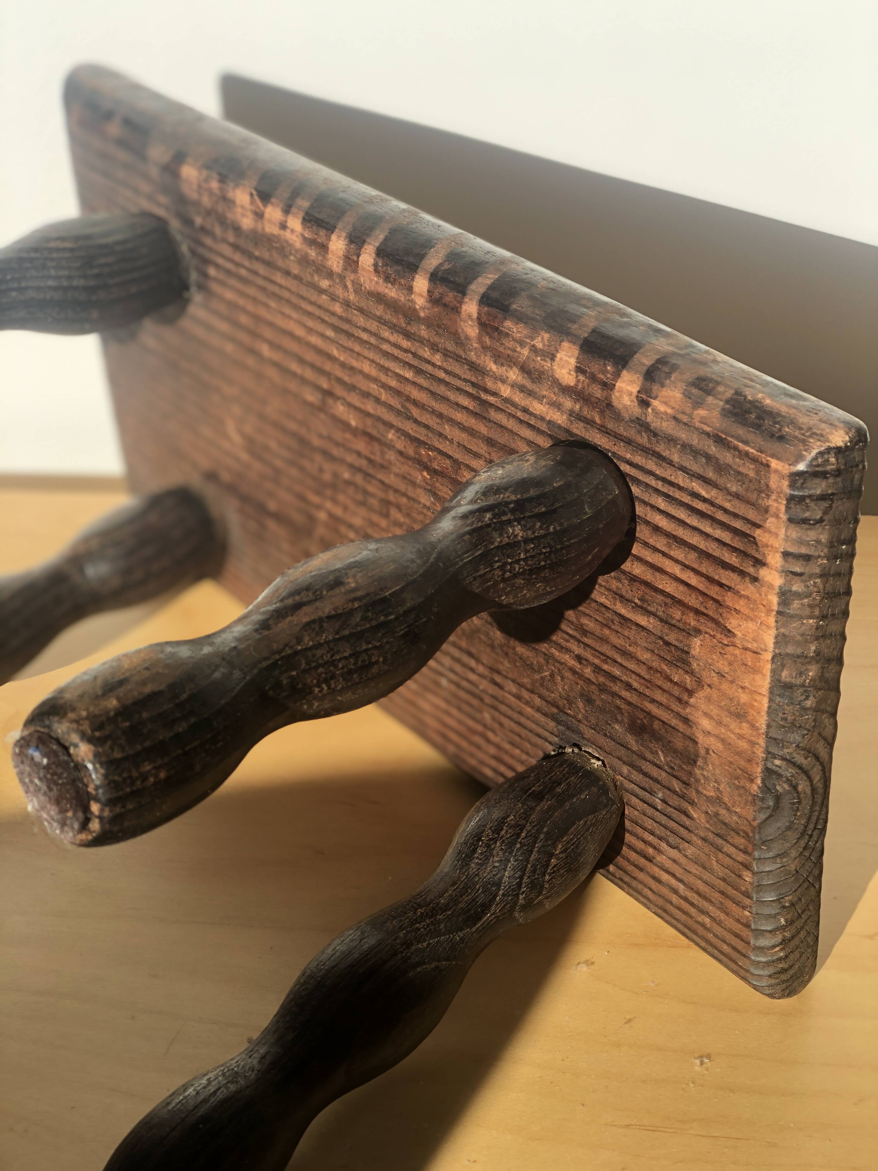 Small wooden bench with beaded legs