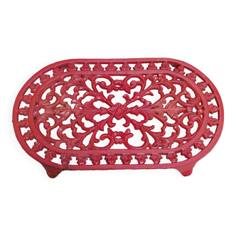Red cast iron trivet