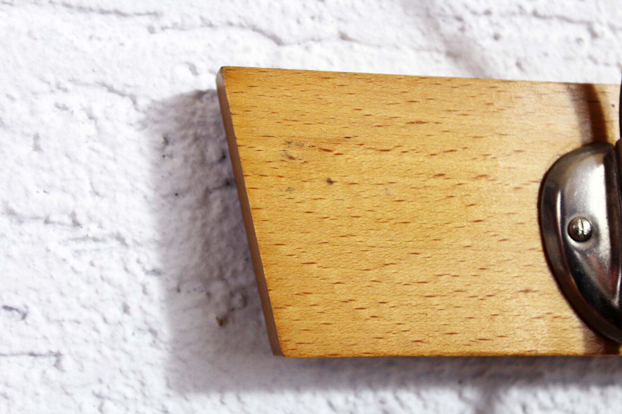 Peg wood and metal, wearing vintage coat