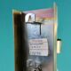Brushed brass wall light with green glass shade "Vitrika". Denmark 1980
