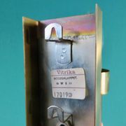 Brushed brass wall light with green glass shade "Vitrika". Denmark 1980