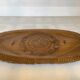 Carved wooden platter in Black Forest style.