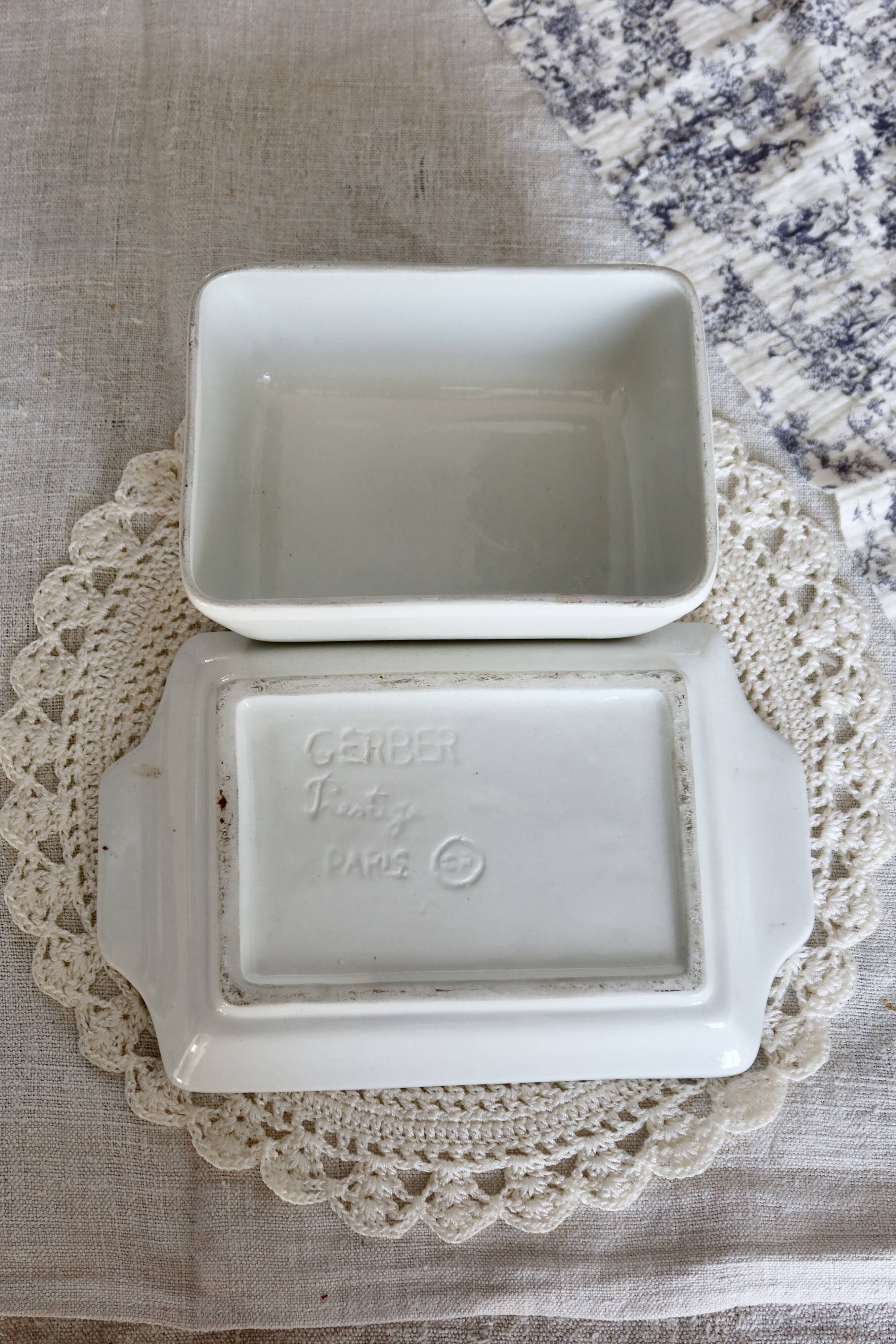 Large vintage faience butter dish with a fruit motif.