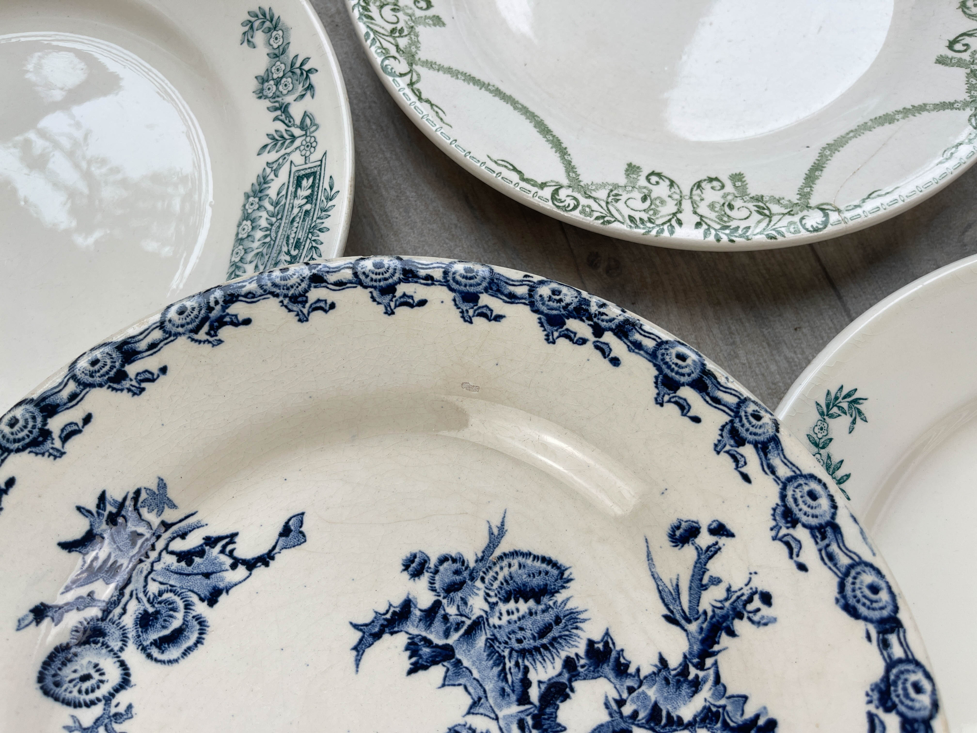 6 green and blue mismatched iron earth plates
