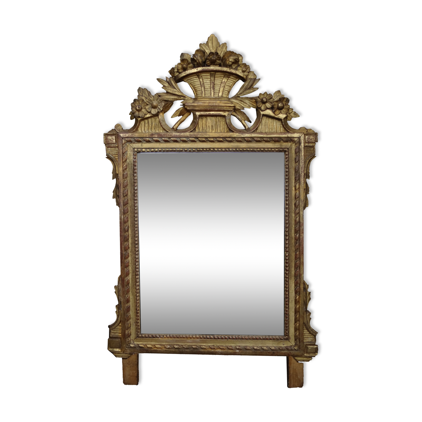 Louis XVI period mirror in gilded carved wood