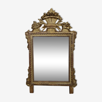 Louis XVI period mirror in gilded carved wood