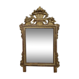 Louis XVI period mirror in gilded carved wood
