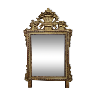 Louis XVI period mirror in gilded carved wood