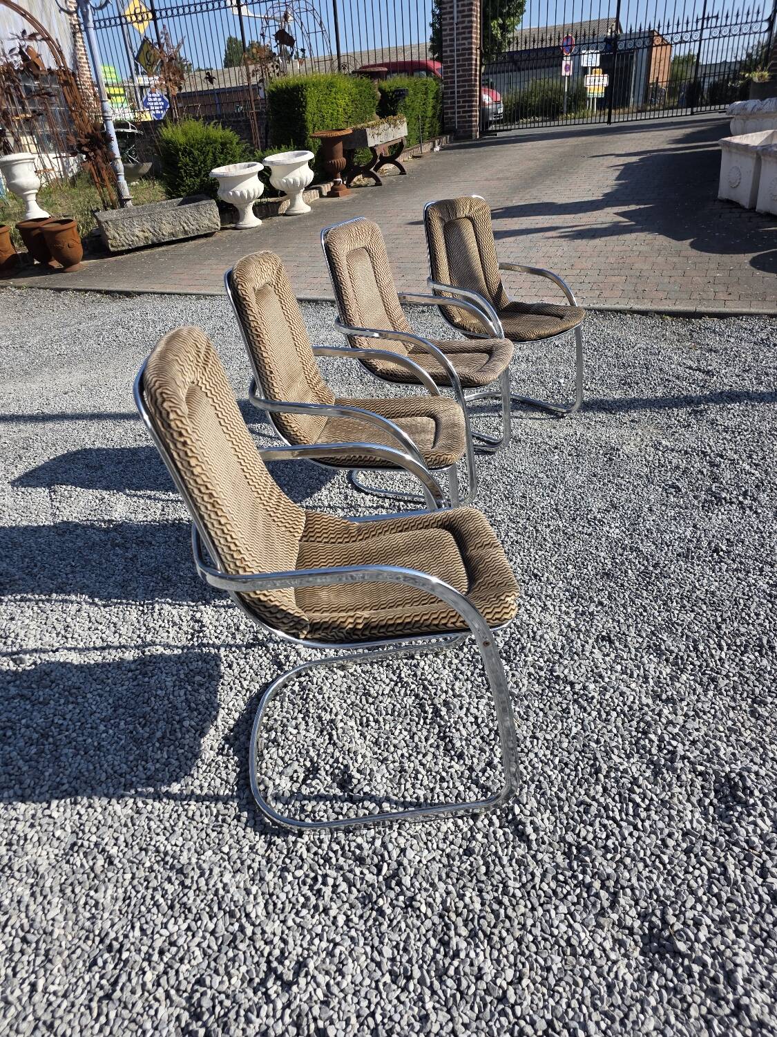 4 chaises Cidue en métal chromé, années 70