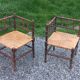 Pair of angled armchairs with turned wood and rush seats from the 1960s.