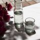 Carafe and glass made of blown and engraved glass.