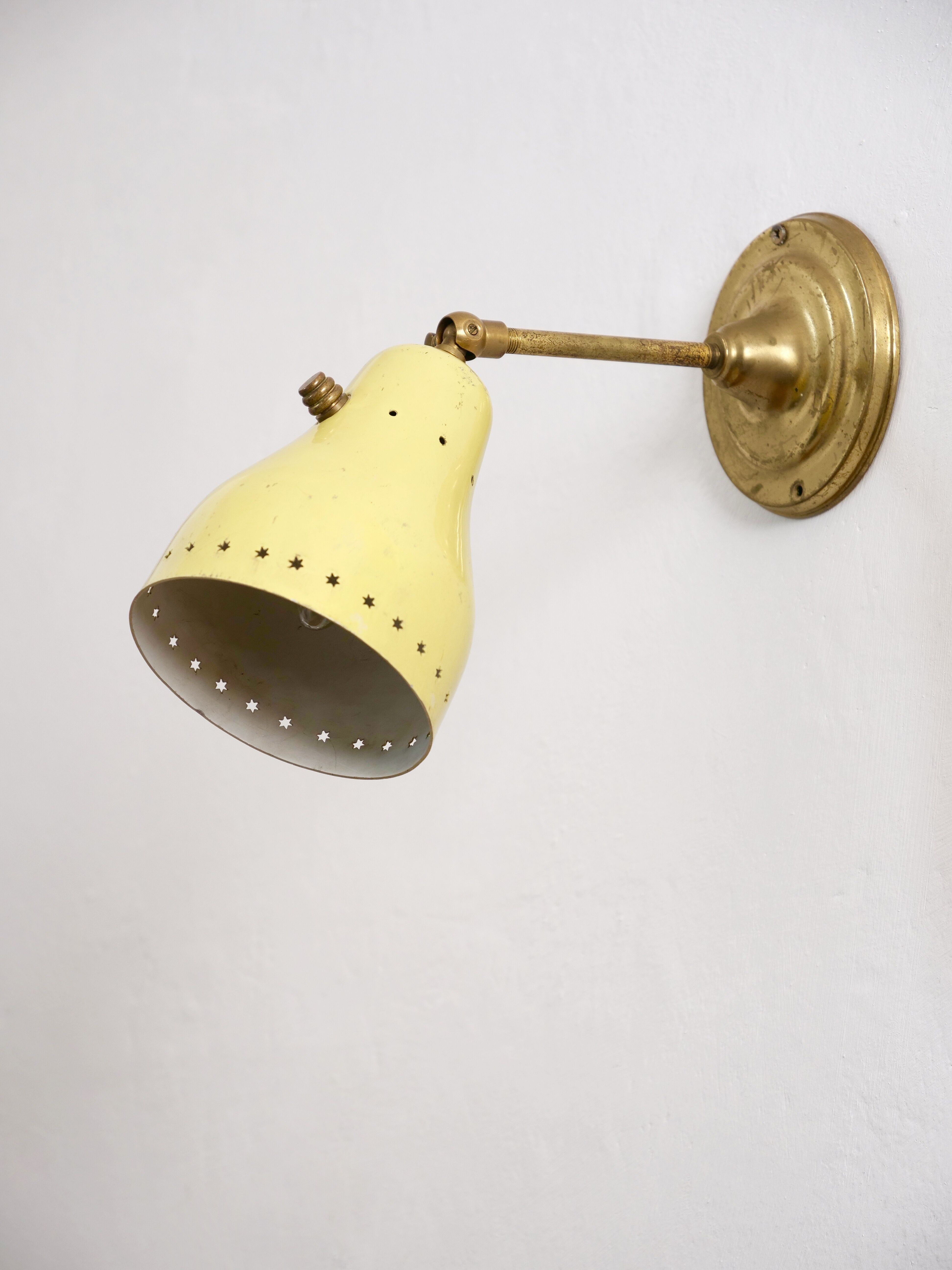 Wall lamp inlaiton and pale yellow lacquered metal