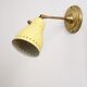 Wall lamp inlaiton and pale yellow lacquered metal