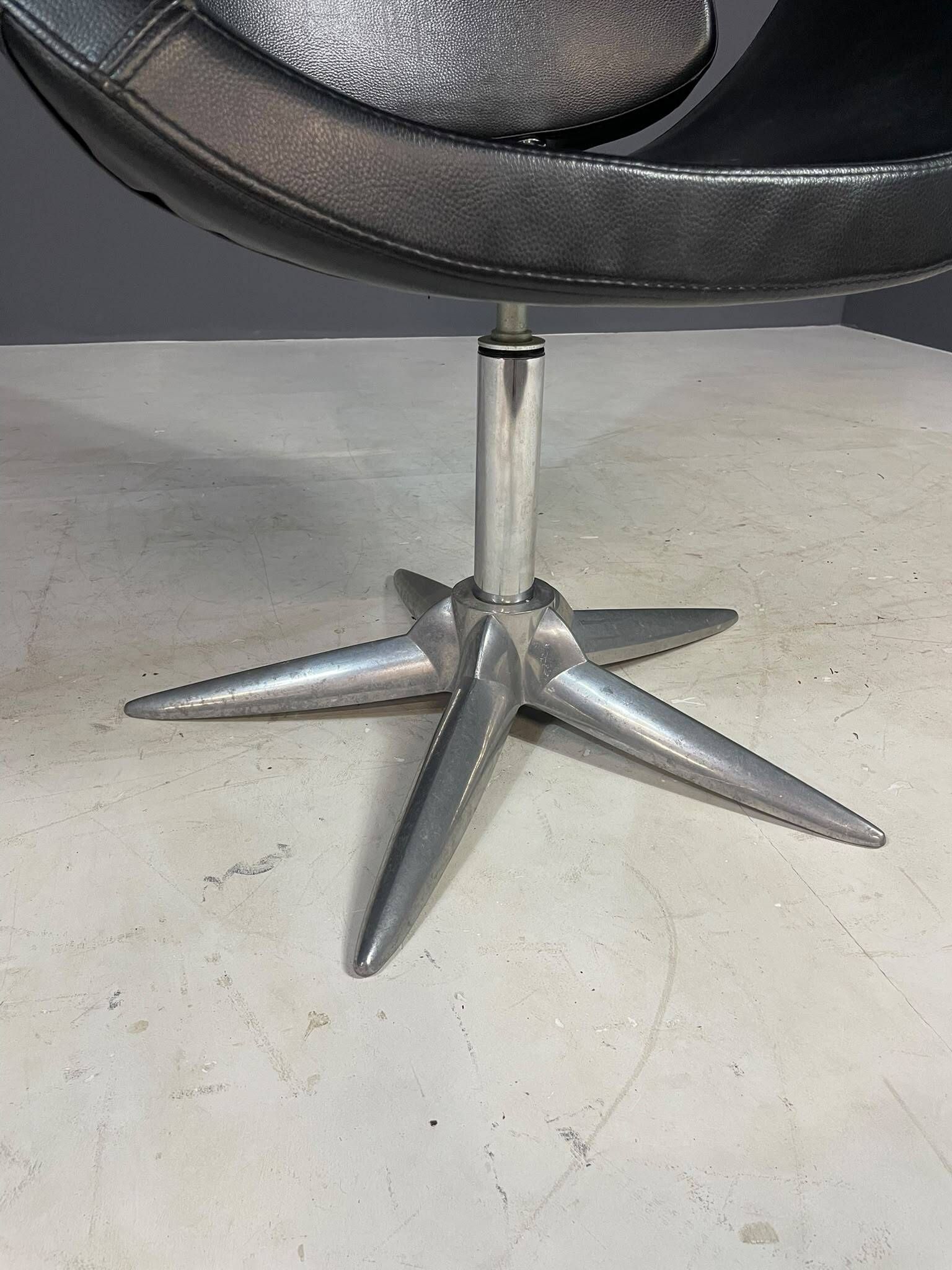 Alipes black swivel salon chair with chrome star base by Giorgetto Giugiaro