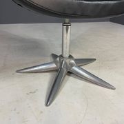 Alipes black swivel salon chair with chrome star base by Giorgetto Giugiaro