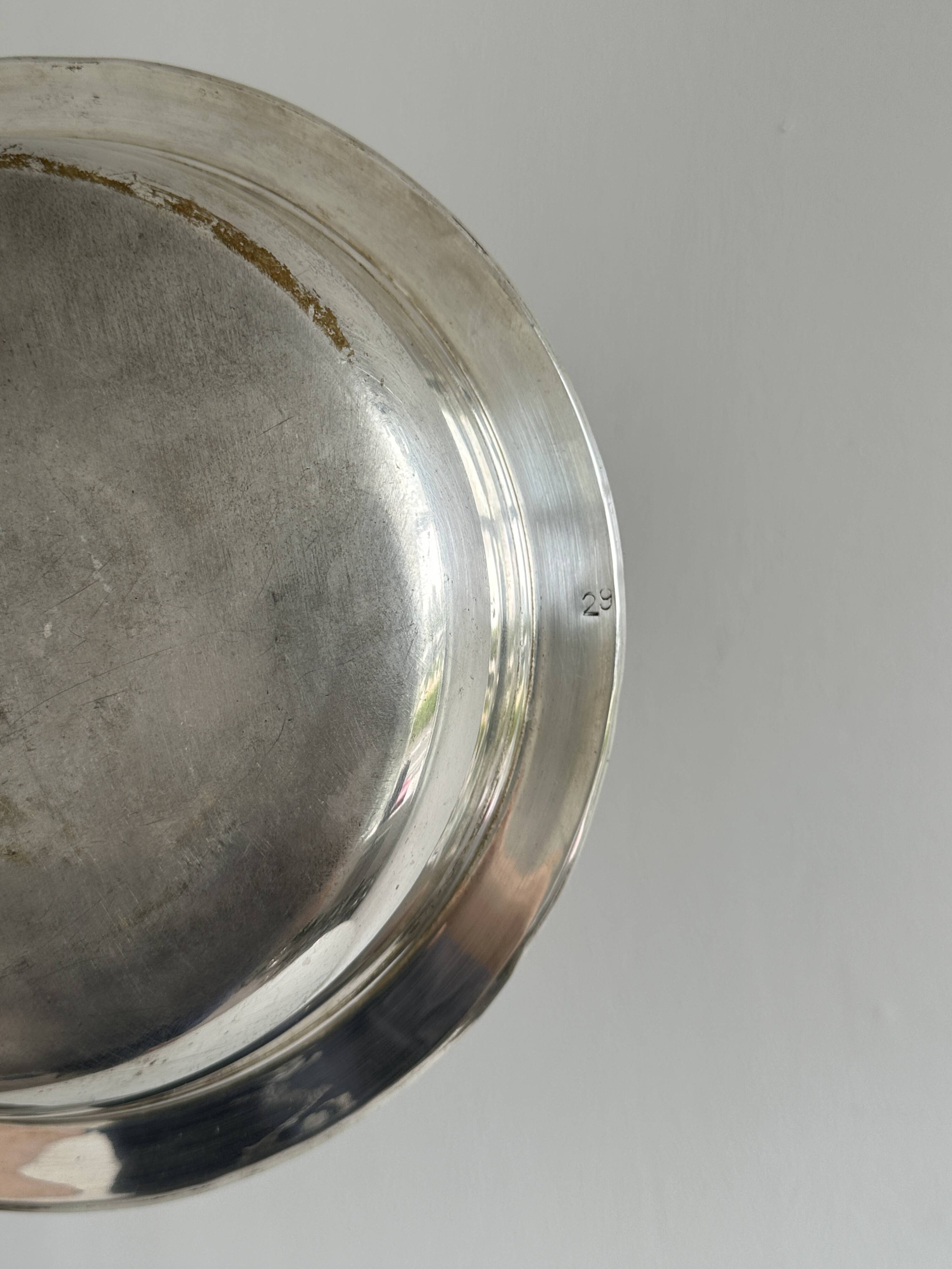 Antique round salad bowl or dish in shiny silver metal