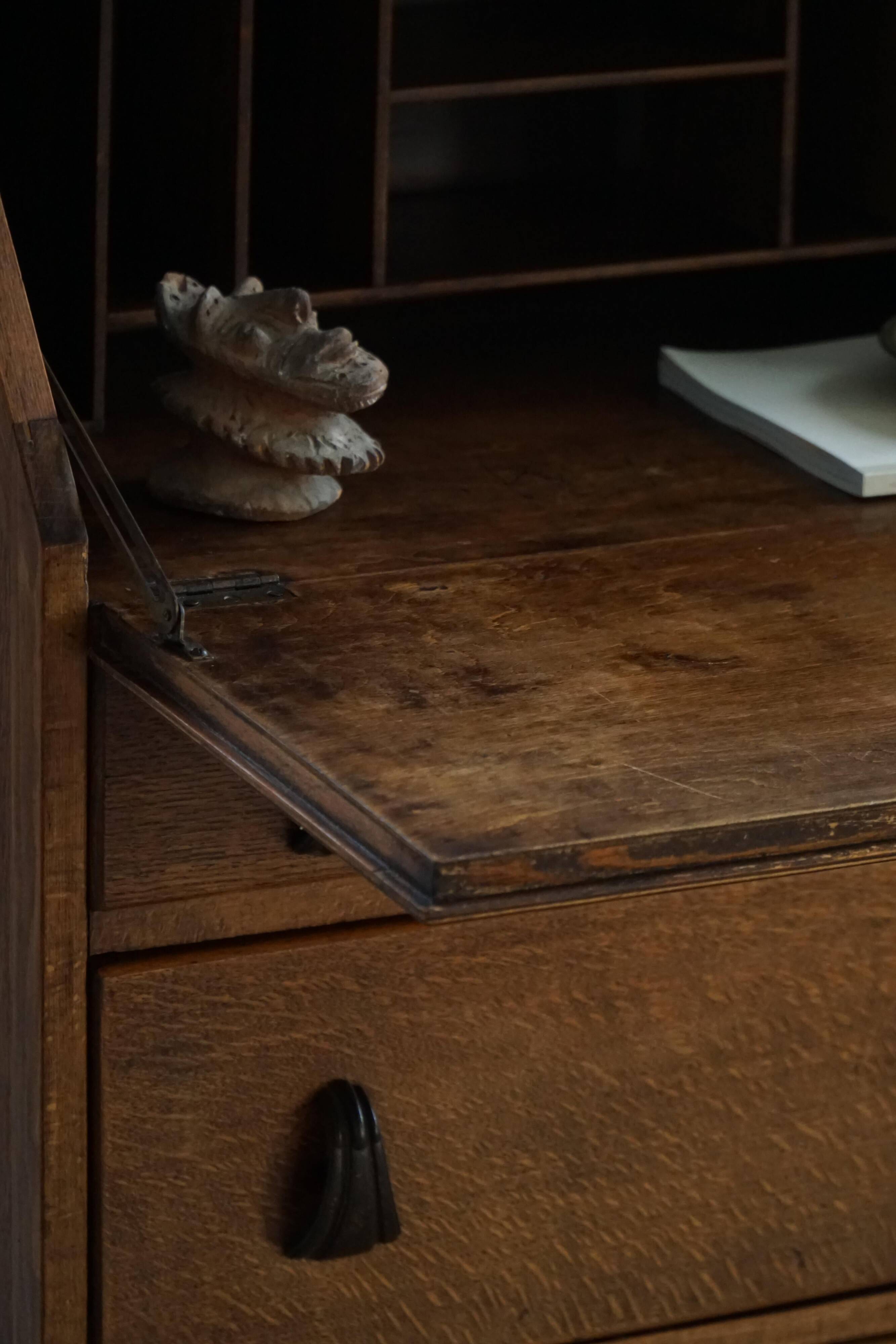 Desk / Chest of drawers in modern Danish oak from the early 20th century with shell handles.