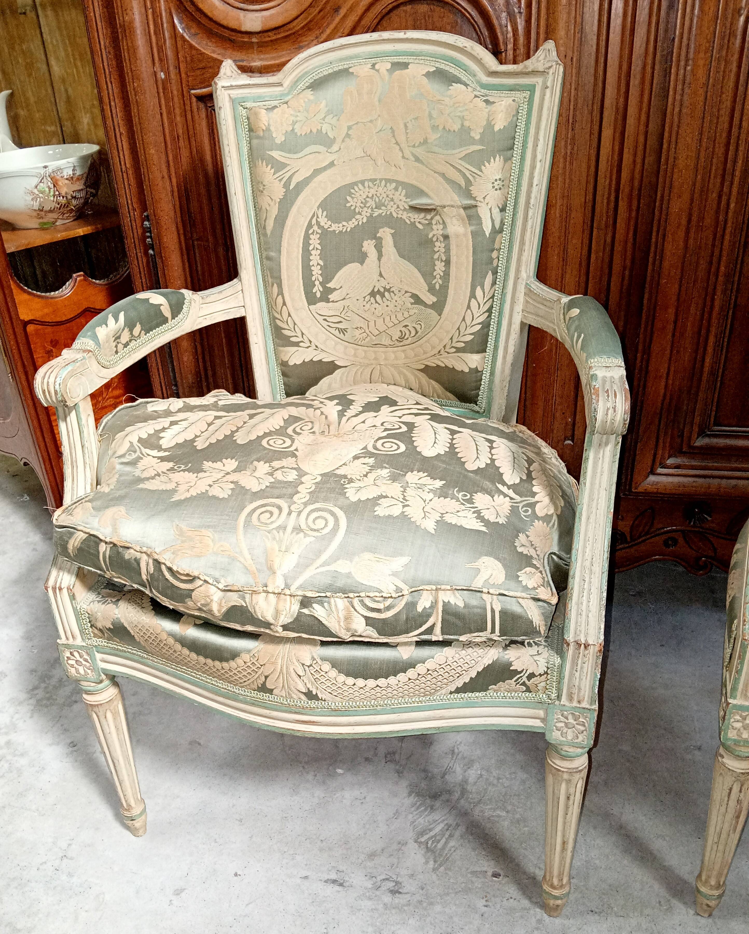 Pair of large Louis XVI armchairs in water green and cream wood.