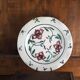 Meyssac plate decorated with flowers on cracked background early twentieth century and its support
