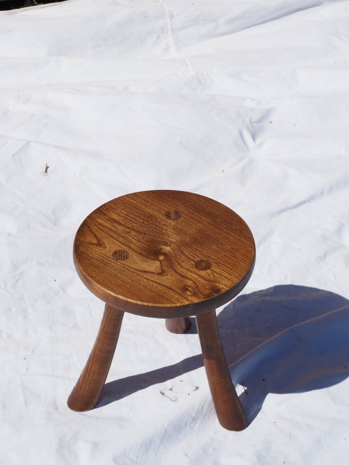 Old rustic milking stool
