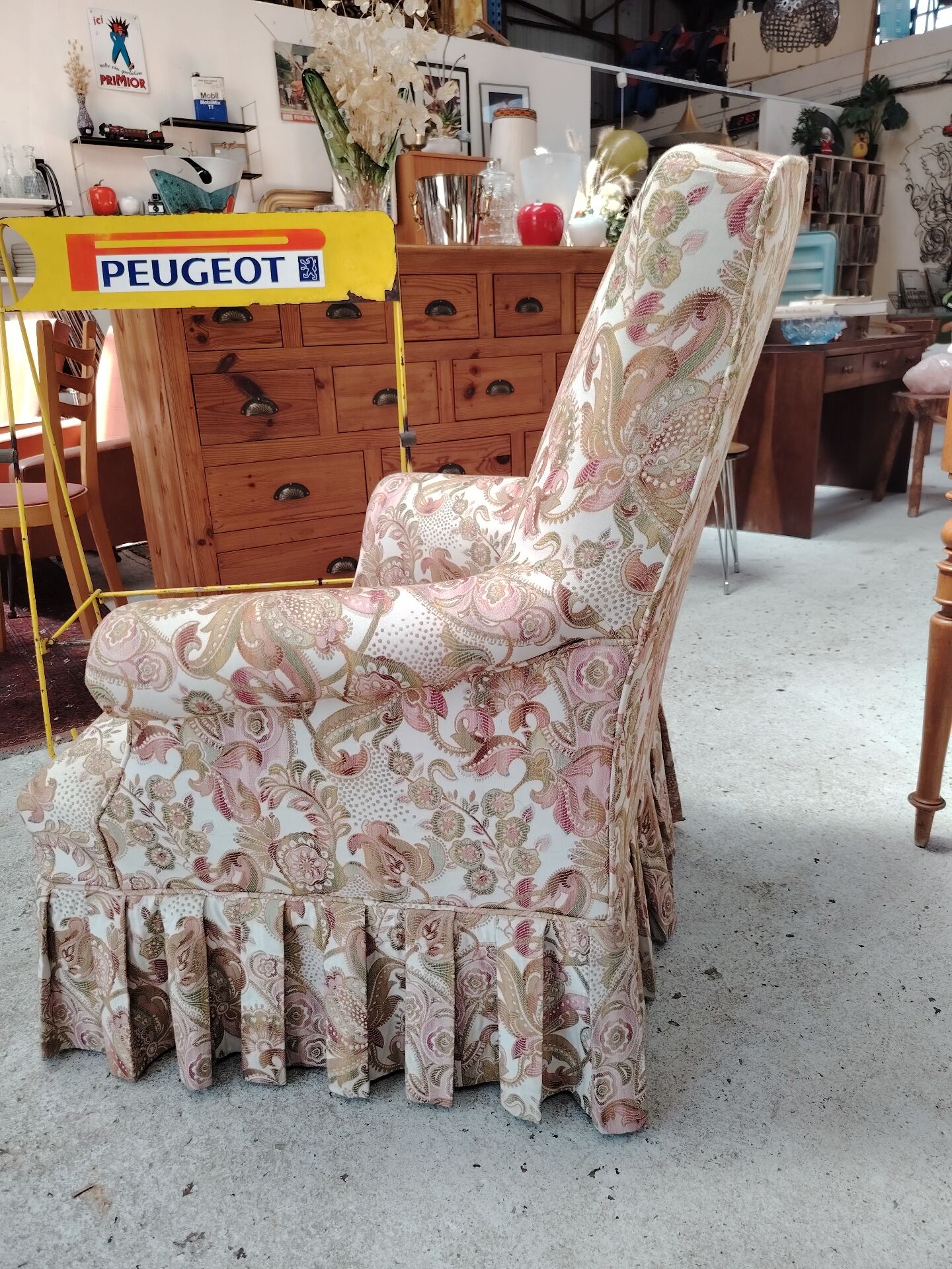 Antique armchair fully restored with brass wheels.