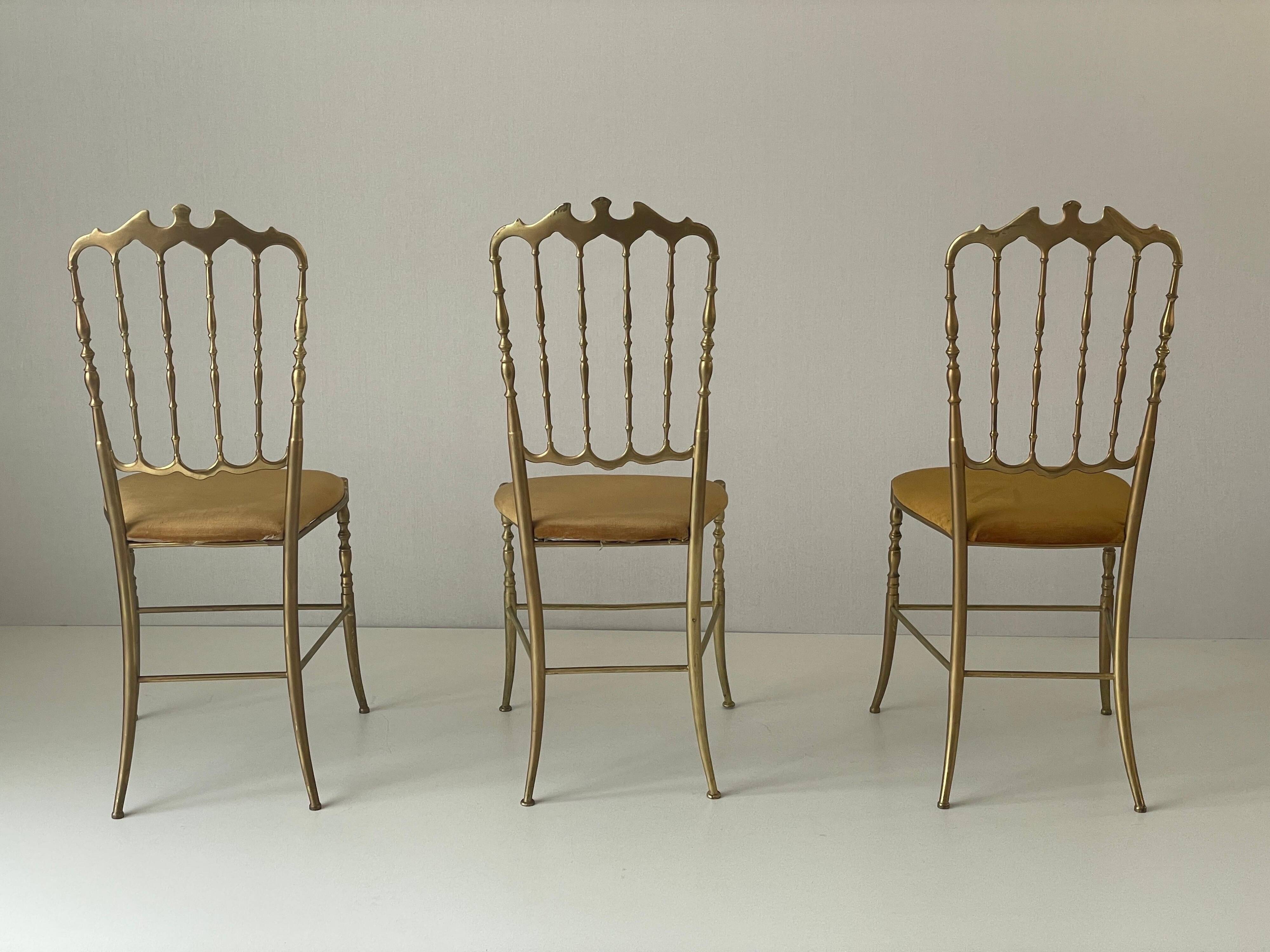 Set of 3 Chiavari chairs in brass with velvet seat and high back, 1950s, Italy.