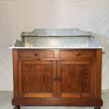 Antique wood and marble kitchen sideboard with carved backsplash