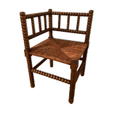 Chaise ancienne d'angle en bois de chêne, assise en cannage