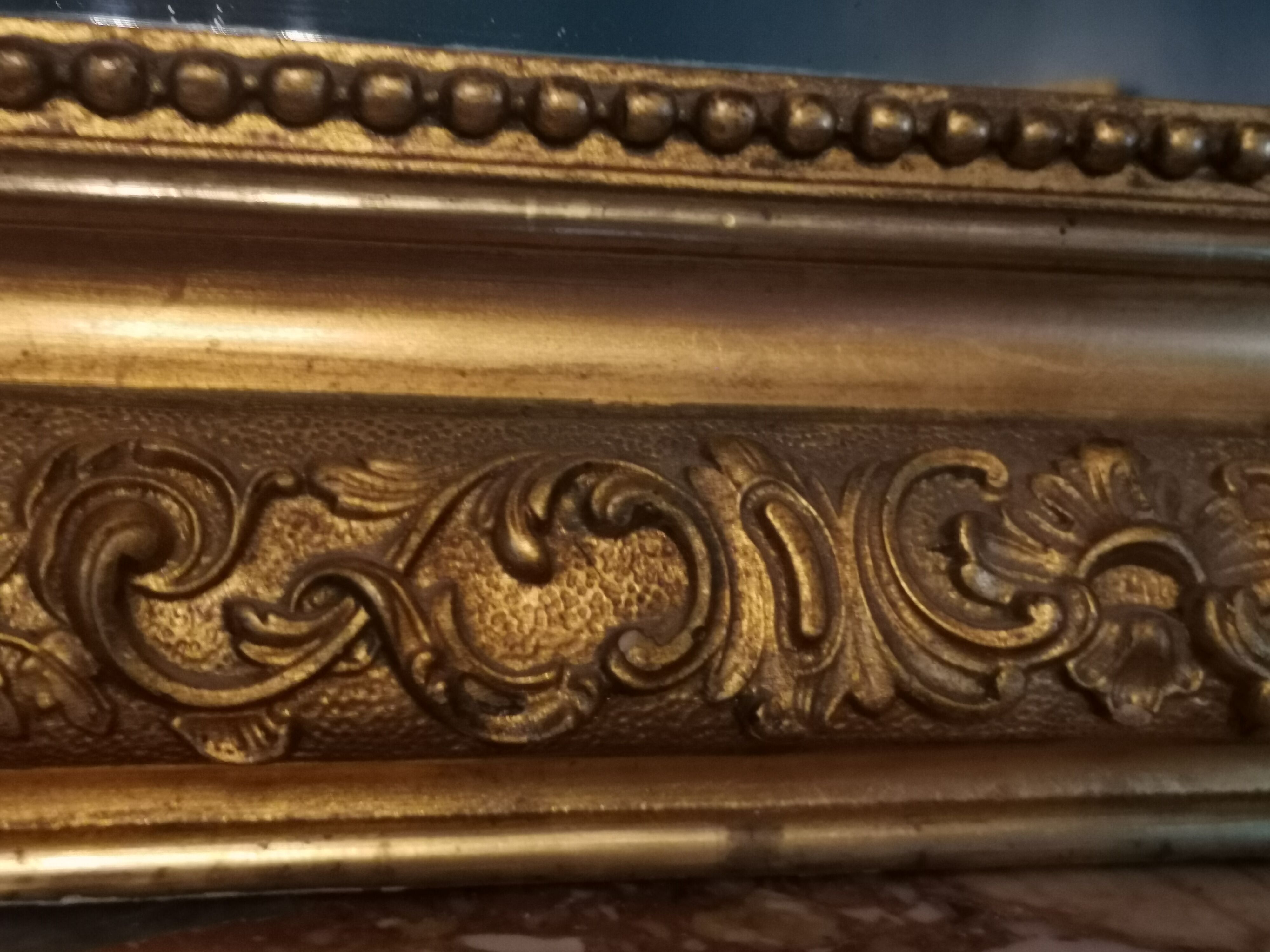 Mirror XIXth in gilded stucco, H 142 cm