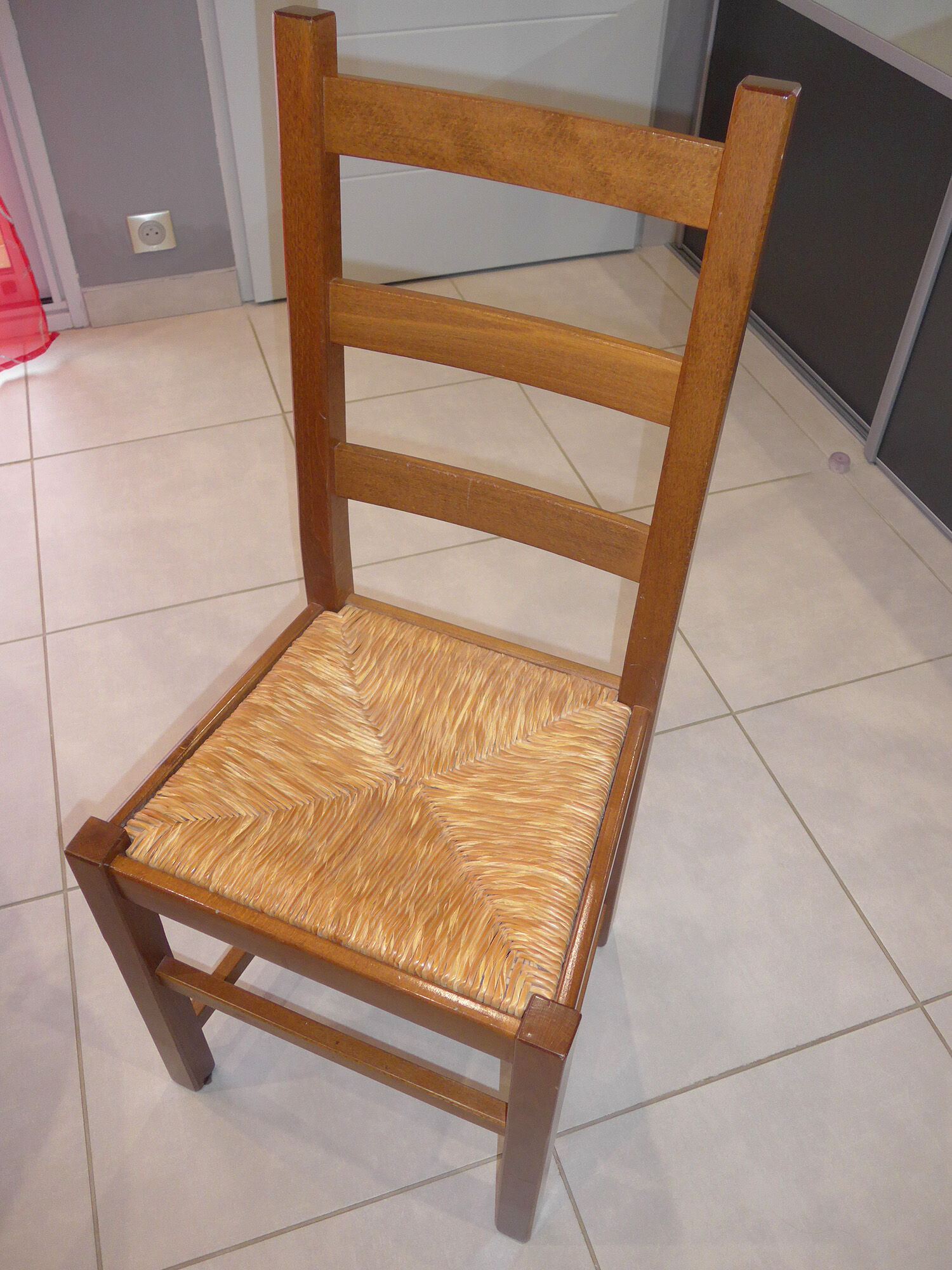 8 wooden chairs, straw seat