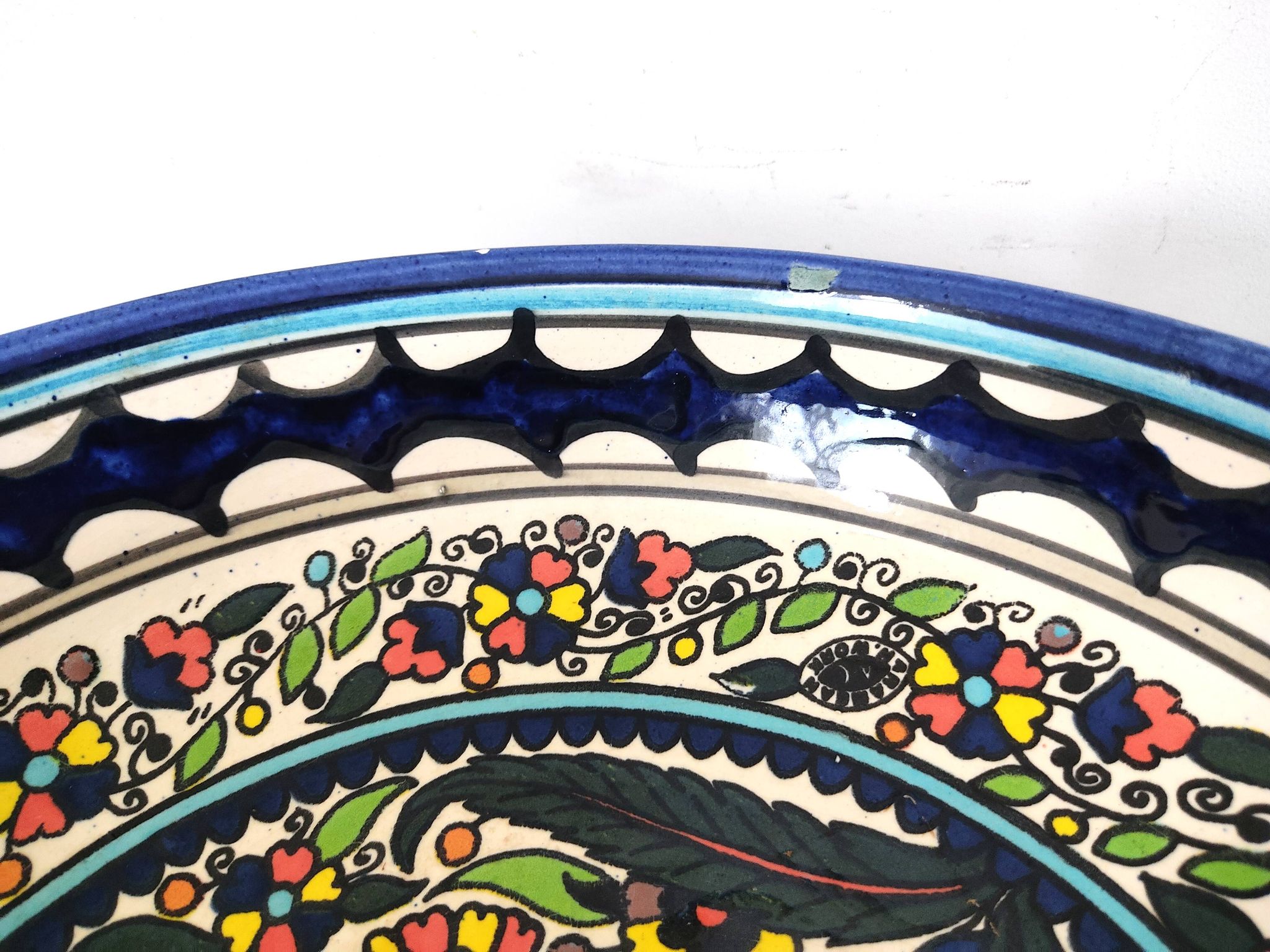 Large decorative dish with colorful peacock