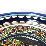 Large decorative dish with colorful peacock