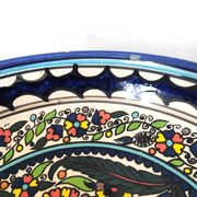 Large decorative dish with colorful peacock