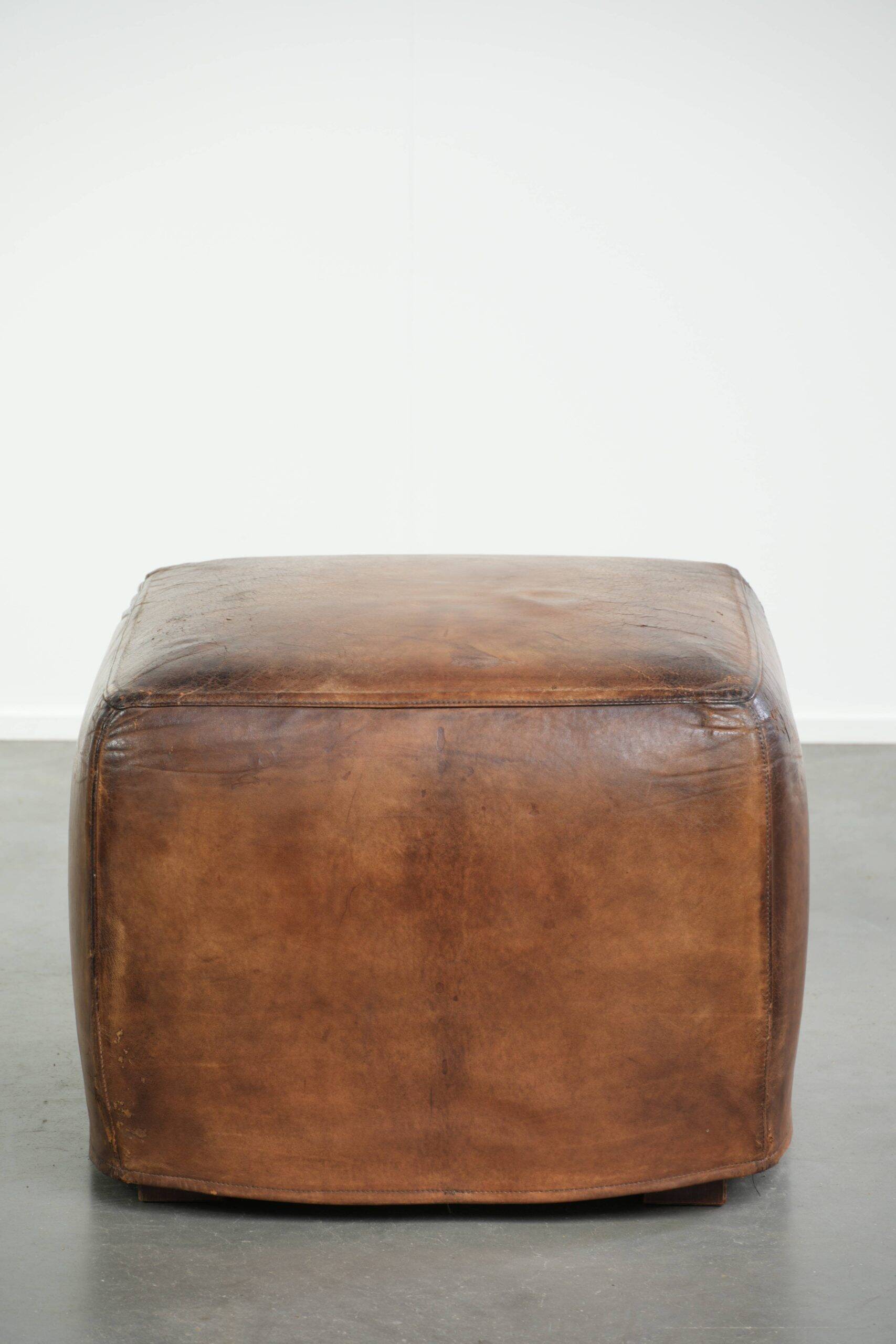 Sheepskin design ottoman with a very beautiful patina and stunning colours